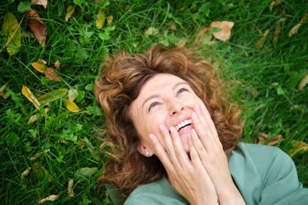 Face, smile and portrait of a woman happy in a park in summer for beauty, excited and confident in nature. garden and female person or model outdoor with freedom, happiness, style. High quality photoの写真素材