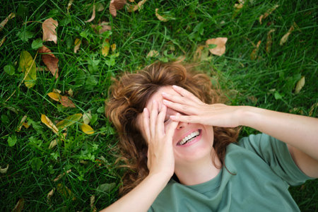 Face, smile and portrait of a woman happy in a park in summer for beauty, excited and confident in nature. garden and female person or model outdoor with freedom, happiness, style. High quality photoの写真素材