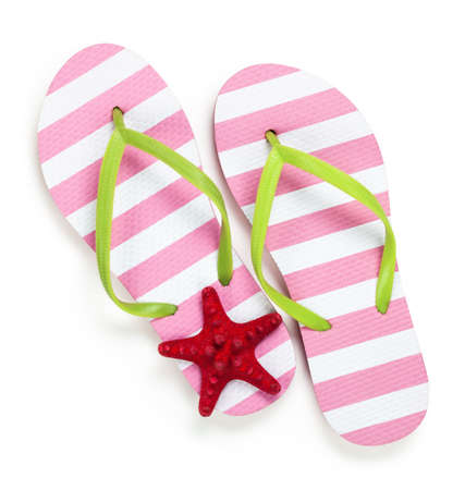 Summer flip flops with starfish on white background. Top view の写真素材