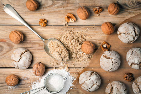 Cracked nut cookies on wood background. Top viewの写真素材
