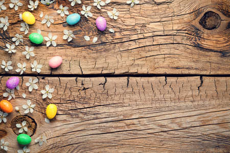 Easter background with blossom and eggs on wooden table. Copy space. Top viewの写真素材