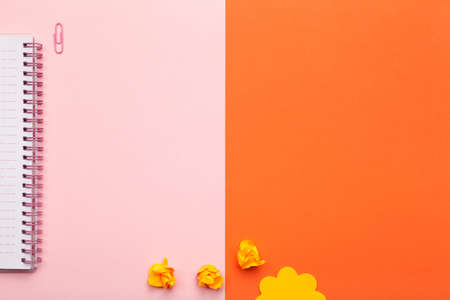School or office accessories on pink and orange background. Minimal style. Flat lay. Copy space. Top viewの写真素材