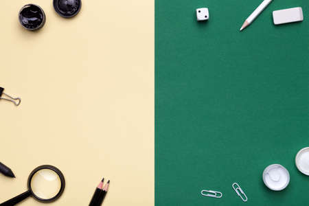 School Supplies on yellow and green background. Flat lay. Minimal style. Copy space. Top viewの写真素材