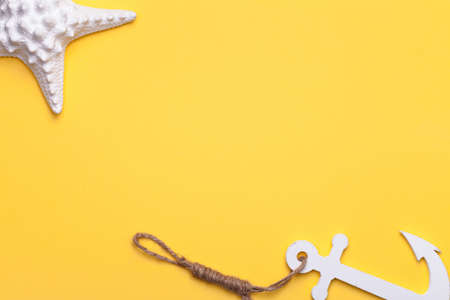 Summer holiday vacation background with starfish and anchor in white. Copy space. Top viewの写真素材