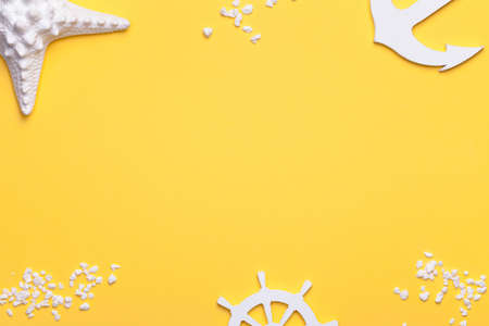 Summer holiday vacation background with starfish, anchor and rudder in white. Copy space. Top viewの写真素材