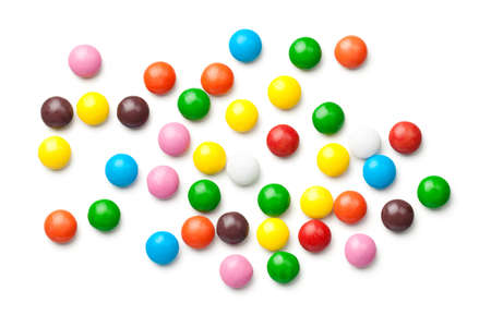 Colorful chocolate candy pills isolated on white background. Top viewの写真素材