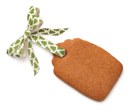 Gingerbread label cookie with ribbon bow isolated on white background. Top viewの写真素材