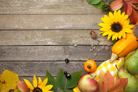 Autumn background on wooden table. Copy space. Top viewの写真素材