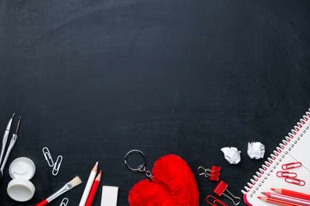 Office supplies on blackboard. Back to school concept background. Copy space. Top view. Flat layの写真素材