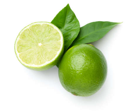 Limes with leaves isolated on white background. Flat lay. Top viewの写真素材