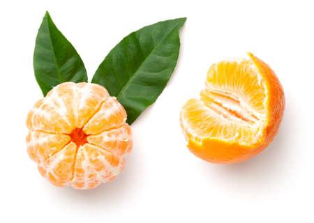 Peeled mandarin orange with green leaves isolated on white background. Clementine, tangerine. Top view. Flat layの写真素材