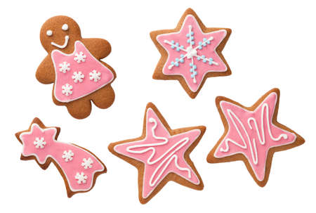 Christmas gingerbread cookies with pink icing isolated on white background. Top viewの写真素材