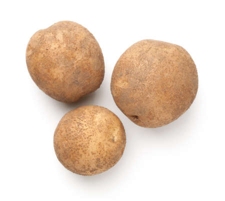 Composition made of natural organic potatoes pulled from the ground. Isolated over white background. Top viewの写真素材
