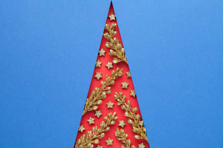 Elegance minimal christmas tree with golden colored twigs and stars. Creative art design. Empty room for text. Top viewの写真素材