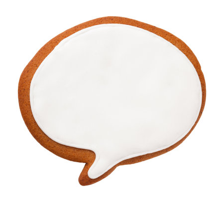 Christmas gingerbread cookie in shape of speech bubble isolated on white backgroundの写真素材