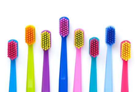 Set of multicolored toothbrushes isolated over white background. Flat lay. Top viewの写真素材