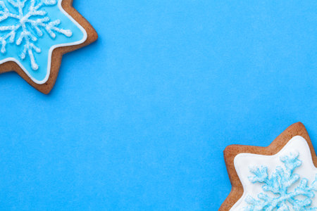 Christmas blue background with gingerbread cookies. Copy space. View from aboveの写真素材