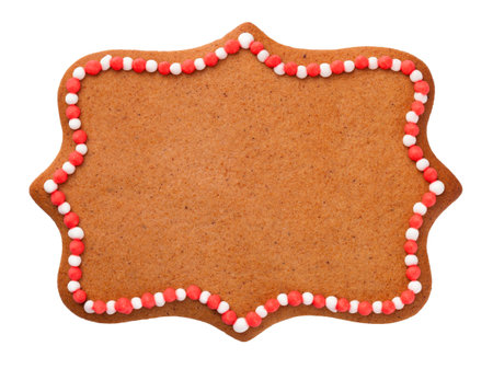 Christmas gingerbread cookie in shape of label isolated over white backgroundの写真素材