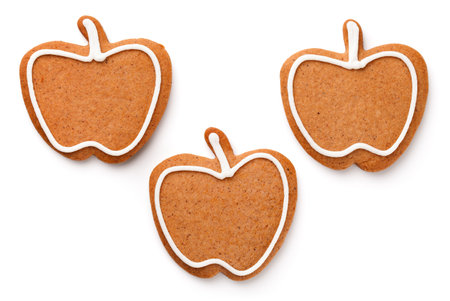 Gingerbread cookies in shape of apple isolated on white backgroundの写真素材