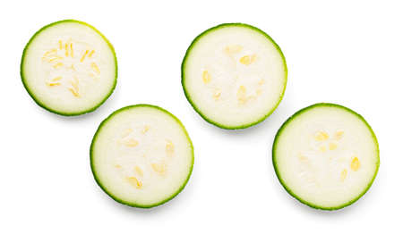 Zucchini slice isolated on white background. Set of four fresh pieces. View from aboveの写真素材