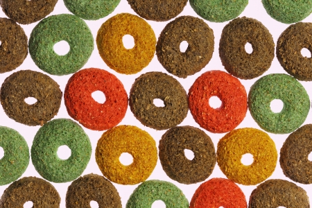 Colorful food for rodents making texture on white background の写真素材
