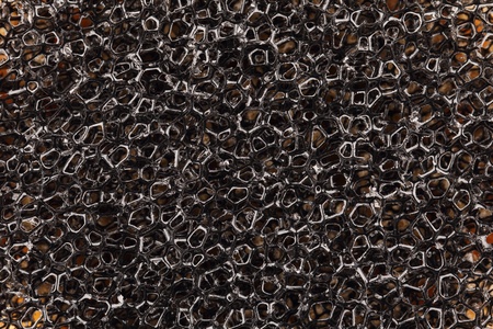black plastic cell sponge background
