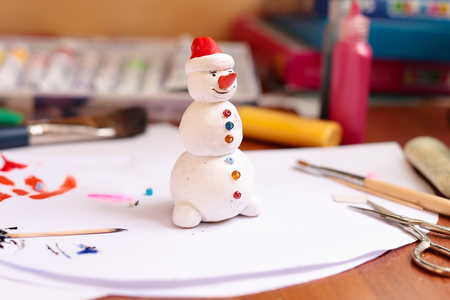 The process of making a handicraft snowman figurineの写真素材