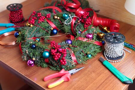 The process of making handicraft christmas wreathの写真素材