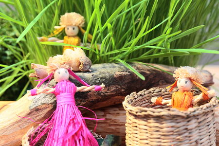 still-life with straw dolls and decorationsの写真素材