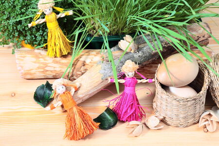 still-life with straw dolls and decorationsの写真素材