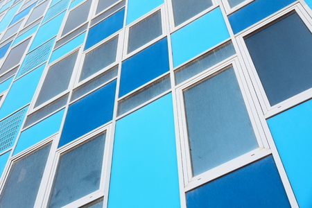 Colorful modern office building front as background