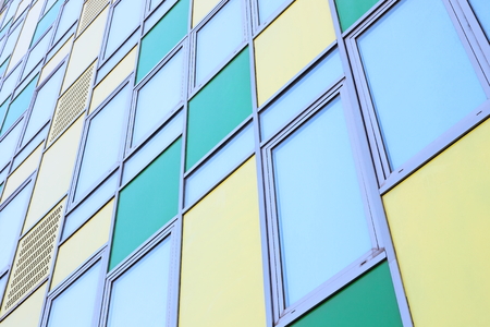 Colorful modern office building front as background