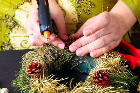 Woman making christmas advent wreath, close upの写真素材