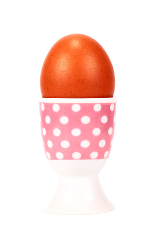 boiled egg in stand isolated on whiteの写真素材