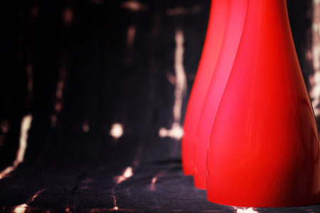 Abstract background with red glass lampshades, close up, selective focusの写真素材
