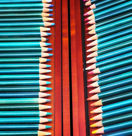 colorful art pencils in a wooden case, close up, selective focusの写真素材