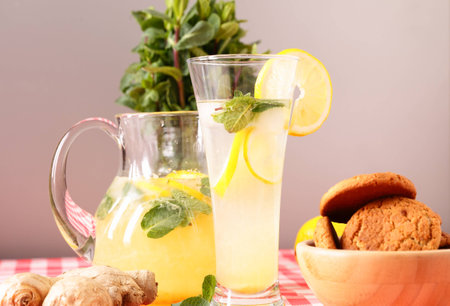 close up of glass of homemade lemonade and oatmeal cookiesの写真素材