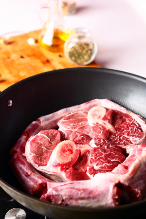 close up of raw meat in a wokの写真素材