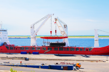 cargo ship loading at the port Dudinka, Russia