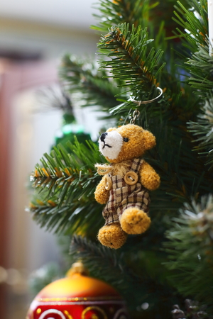 Small bear toy on the christmas tree, close upの写真素材