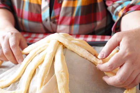 Preparing baking basket from dough for easter