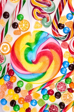 Colorful lollipops and different candiesの写真素材