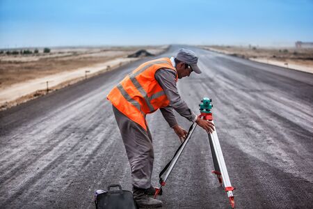 Near Baikonur,Kazakhstan - June 10, 2011, Road worker on the construction of road