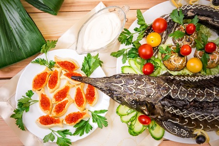 The stuffed sturgeon baked on a platterの写真素材