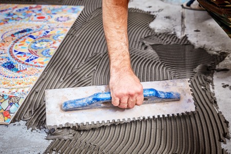 Laying floor ceramic tileの写真素材