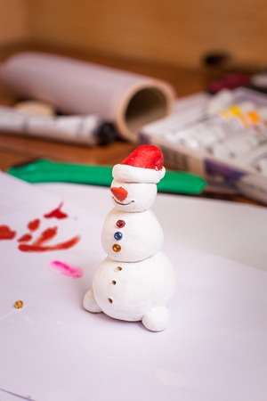 The process of making a handicraft snowman figurineの写真素材