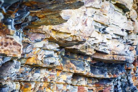 Fragment of sedimentary rock as background texture