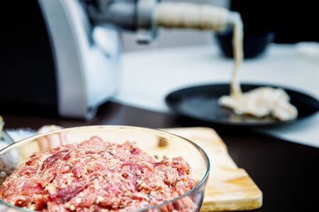 Process of making homemade sausage, sausage stuffing, selective focusの写真素材