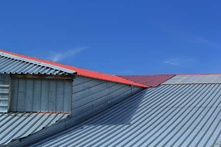 Fragment of a metal roof on blue