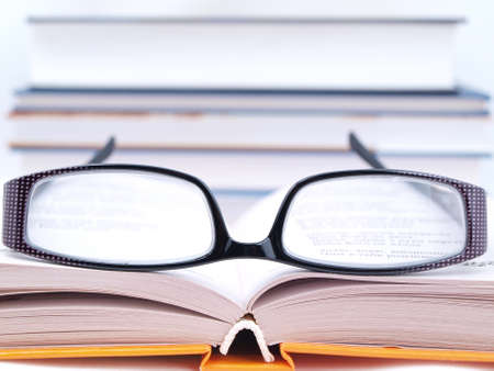 Glasses lying on the open book    の写真素材